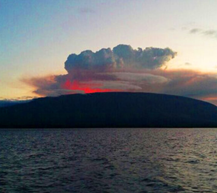 Morning view of La Cumbre volcano in Fernando Island Morning view of the erupting La Cumbre volcano in Fernando Island, Galapagos
