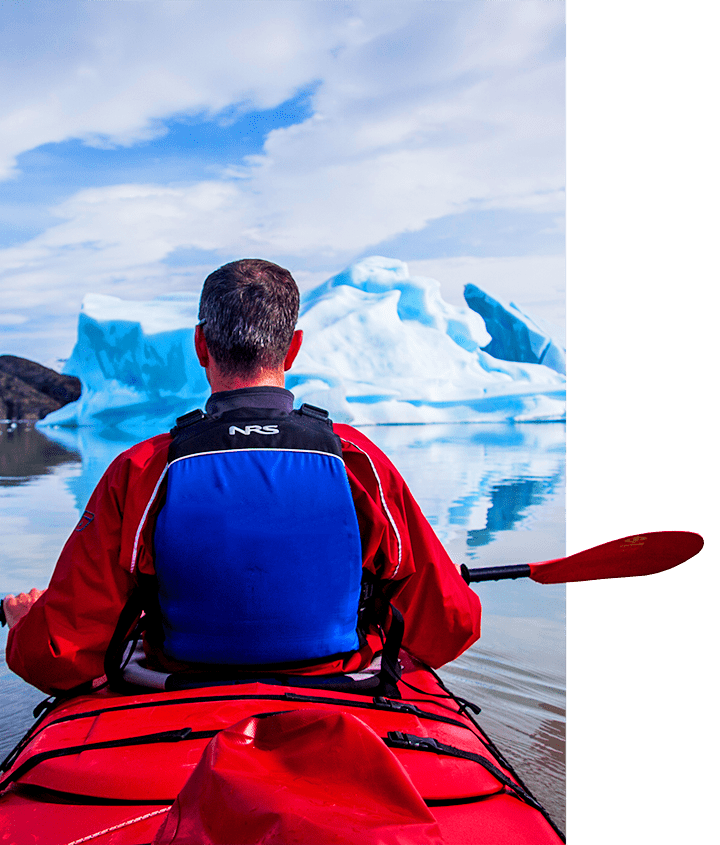 Bachelor on a Patagonia Destination Trip A bachelor in a red kayak paddling through the glaciers in Patagonia