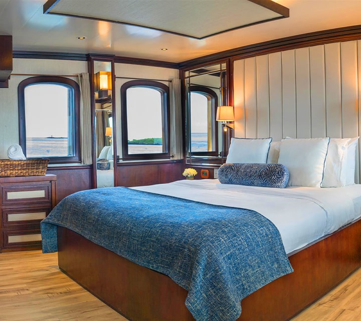 Grace Kelly Suite within the Grace Yacht sits atop with wonderful window views for enhanced cruising experience in the Galapagos