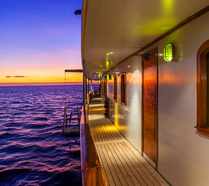Grace Yacht Deck Hallway Guests can move freely around the spacious social areas and deck hallway of the Grace or Evolution Yacht with Quasar Expeditions