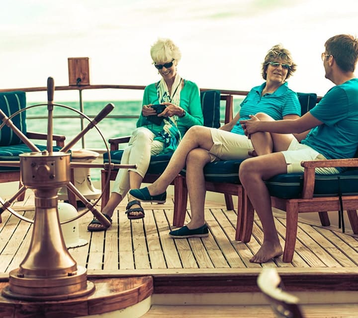 Travelers getting ot know each other aboard Quasar's luxury yacht in the Galapagos Islands