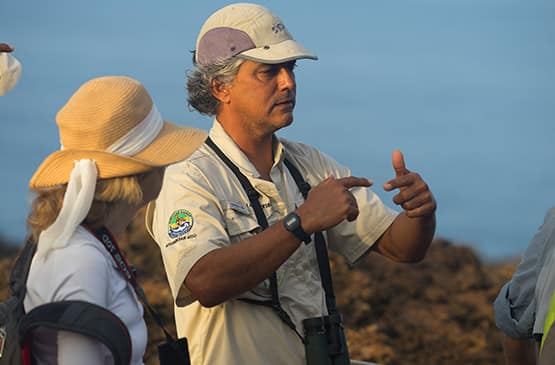 Certified Naturalist Guide speaking with a Guest about Galapagos Islands