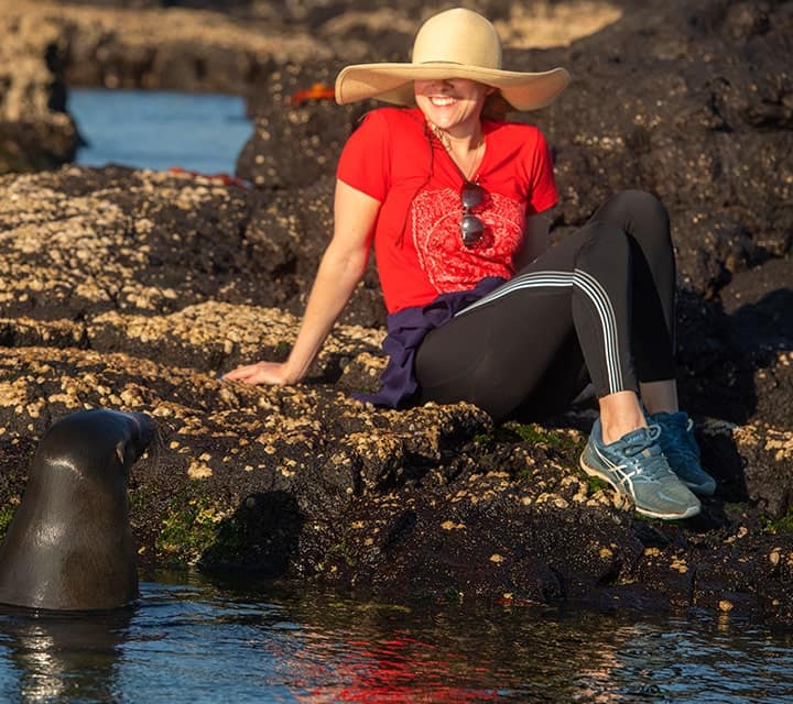 lady with galapagos sea lion lady with sunhat and sea lion