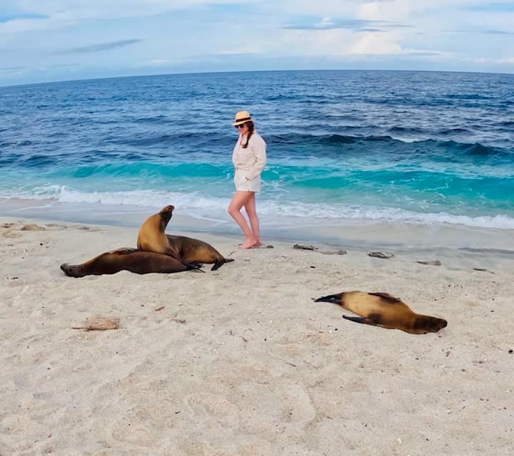 Lady with Galapagos sea lions