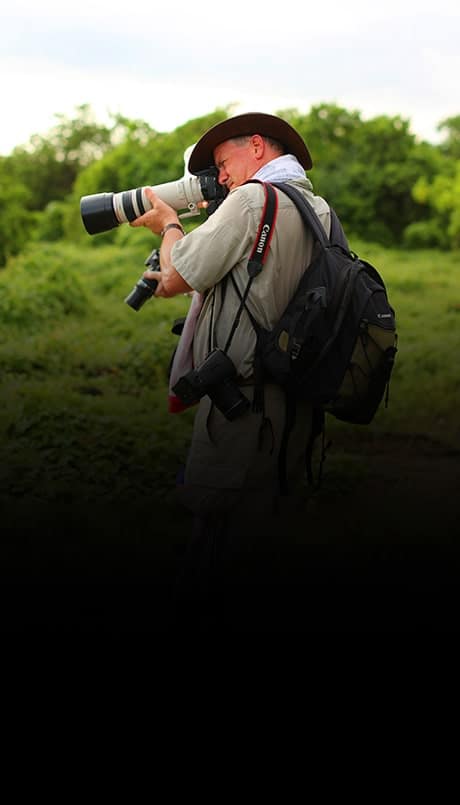 Man photographing stunning Galapagos landscapes with camera