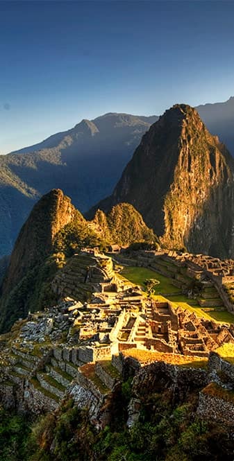 Machu Picchu, Peru Sun setting on Machu Picchu, Peru