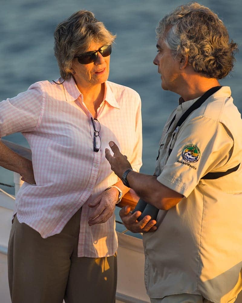 Galapagos Naturalist Guide educating guest about Galapagos