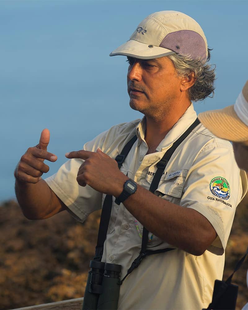 Certified Naturalist Guide sharing Galapagos facts with Quasar guest