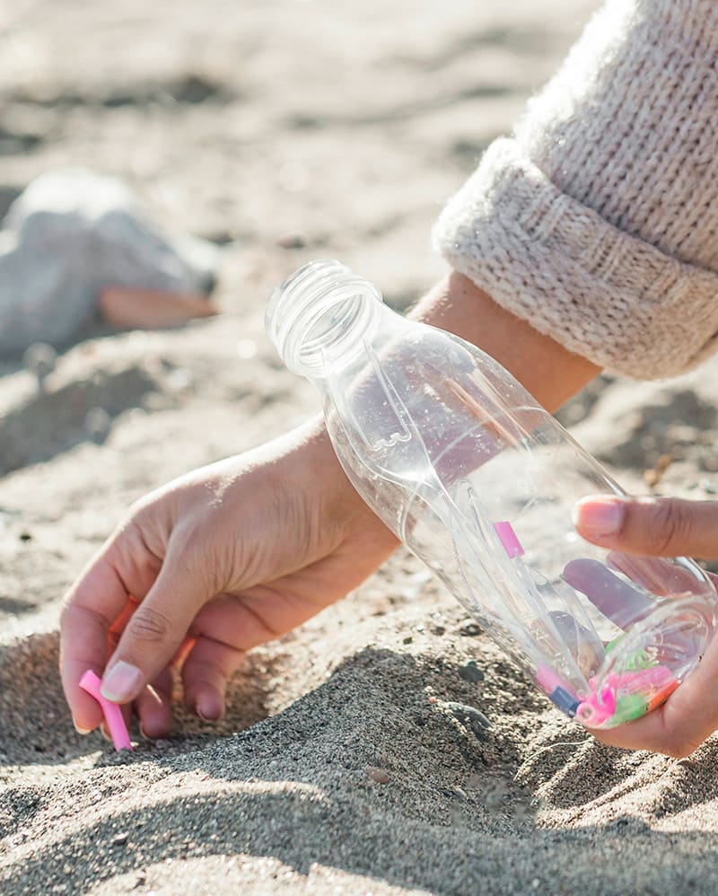 Plastic water bottle litter on beach