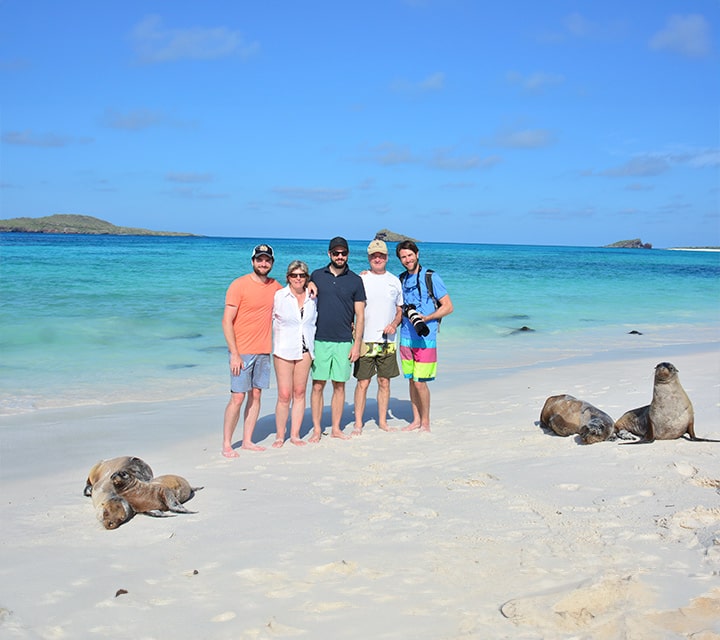 Diez family posing on Galapagos Beach