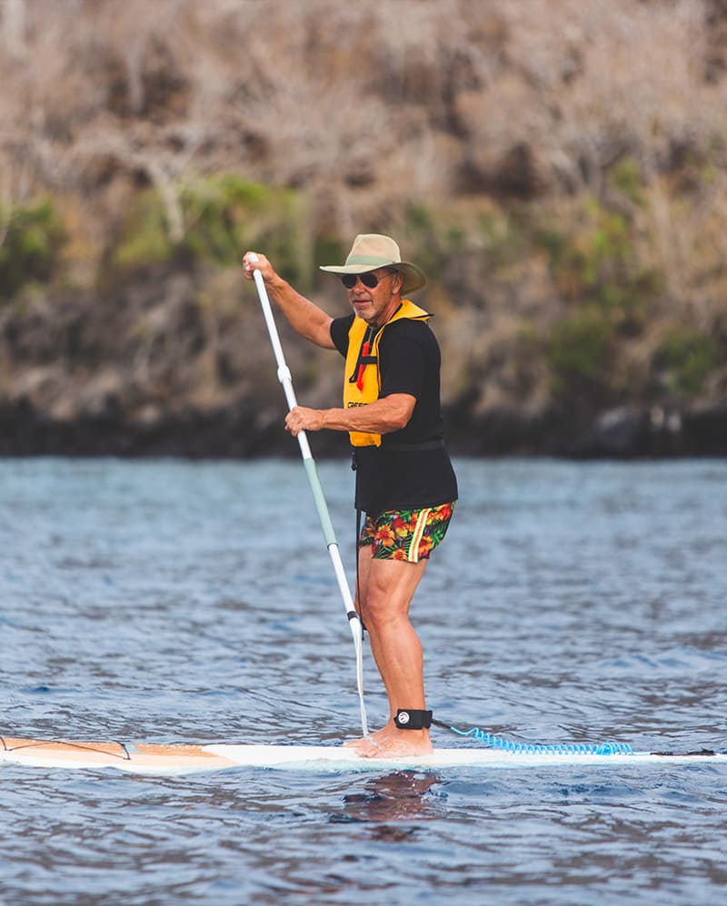 Adventurer Stand-up Paddleboarding Amidst Galapagos Waters